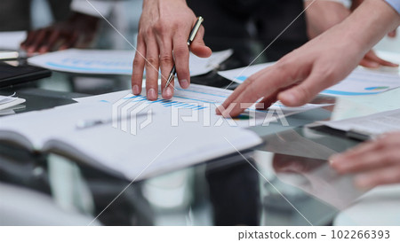 Financial Business man analyze the graph of the company's performance to create profits and growth, 102266393