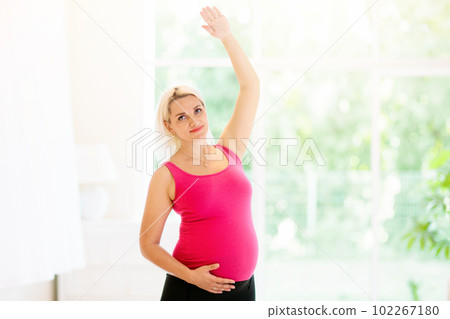 Pregnancy yoga. Exercise for pregnant woman. 102267180