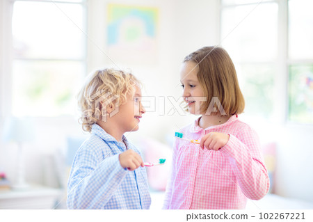 Child brushing teeth. Kids with toothpaste, brush. 102267221
