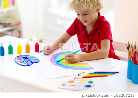 Kids paint. Child painting. Little boy drawing. 102267232