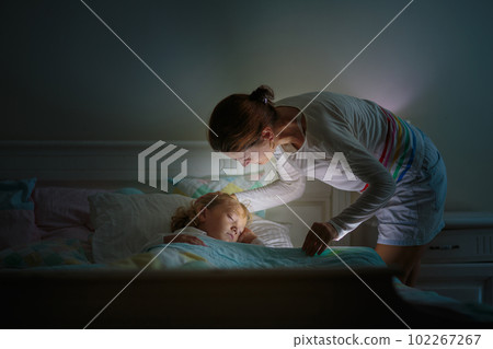 Child sleeping in dark bedroom. Little boy napping Child sleeping in dark bedroom. Little boy napping 102267267
