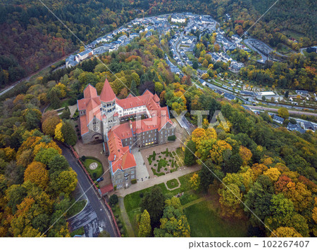 Aerial drone Shot of Abbey in Clervaux, Luxembourg in mystery evening twilight Aerial drone Shot of Abbey in Clervaux, Luxembourg in mystery evening twilight 102267407