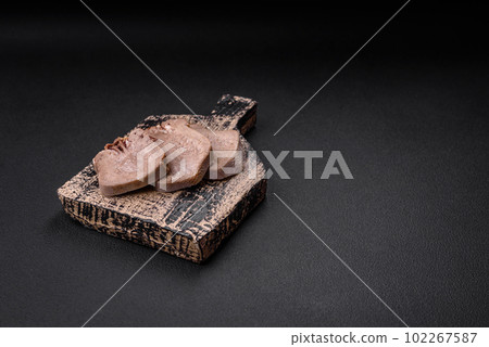 Delicious boiled beef tongue sliced with vegetables and spices Delicious boiled beef tongue sliced with vegetables and spices 102267587