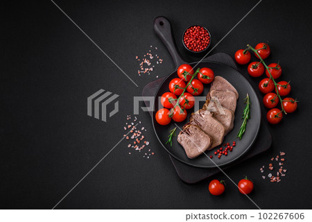 Delicious boiled beef tongue sliced with vegetables and spices 102267606