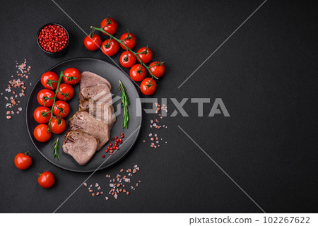Delicious boiled beef tongue sliced with vegetables and spices 102267622