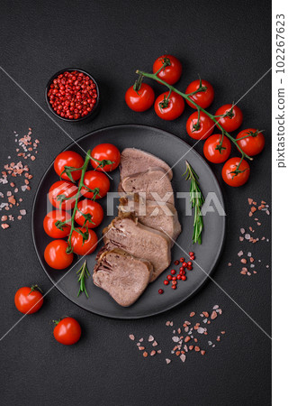Delicious boiled beef tongue sliced with vegetables and spices 102267623