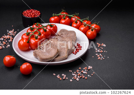 Delicious boiled beef tongue sliced with vegetables and spices 102267624