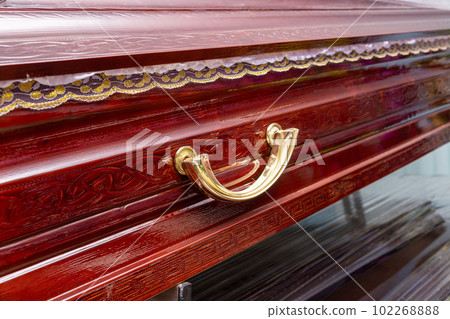 Closeup shot of a funeral casket or coffin in a spicialized shop. 102268888