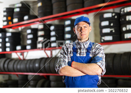 Portrait of mechanic man with auto tires in tire service 102270832