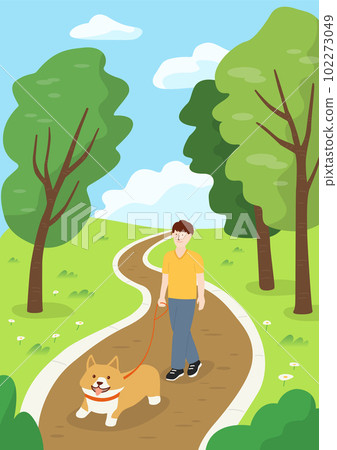 A man walking a Welsh Corgi puppy in the park. A man walking a Welsh Corgi puppy in the park. 102273049