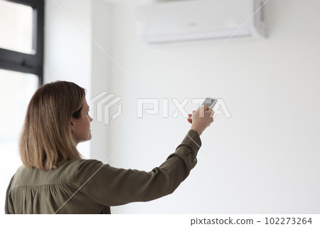 Manager stabilizes temperature in office with remote control Manager stabilizes temperature in office with remote control 102273264