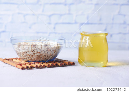 peanuts and oils in a container 102273642