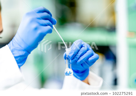 biochemical test in the laboratory. a substance in a glass test tube biochemical test in the laboratory. a substance in a glass test tube 102275291