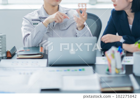 A young woman consulting a designer about a design Faceless A young woman consulting a designer about a design Faceless 102275842
