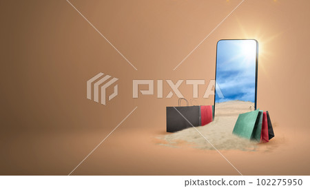 Shopping bags and mobile phone screen with a view of sand dune 102275950
