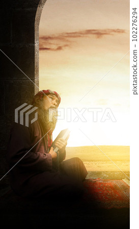 Muslim man with a beard wearing keffiyeh with agal holding Quran and prayer beads in his hands Muslim man with a beard wearing keffiyeh with agal holding Quran and prayer beads in his hands 102276294