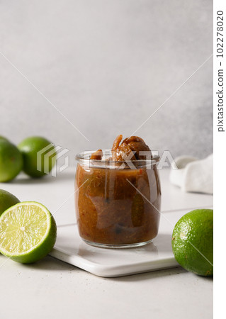 Popular Sri Lankan Lime Pickle of lime, salt, chilli, pepper.  102278020