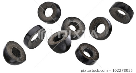 Falling black olive slices isolated on white background Falling black olive slices isolated on white background 102278035