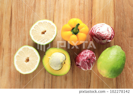 Mixed fruits and vegetable on wooden table background 102278142