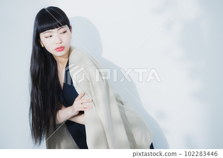 woman blowing her hair 102283446