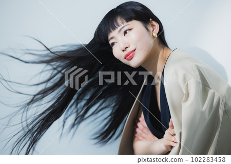 woman blowing her hair 102283458
