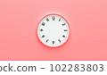Clock face on pink background. 102283803
