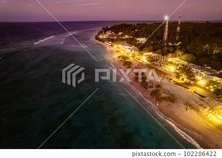 Aerial view of Gili Trawangan beach during sunset in Lombok, Indonesia 102286422