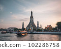 Wat Arun at sunset with long tail boat, in Bangkok, Thailand. Generative AI 102286758