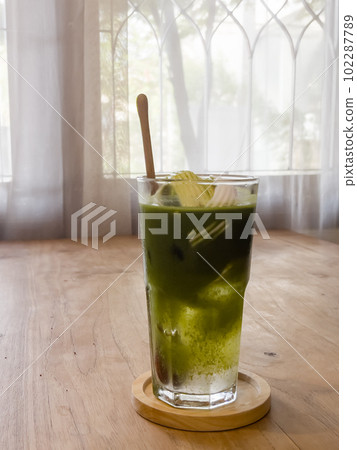 Green tea with coconut juice in coffee shop cafe 102287789