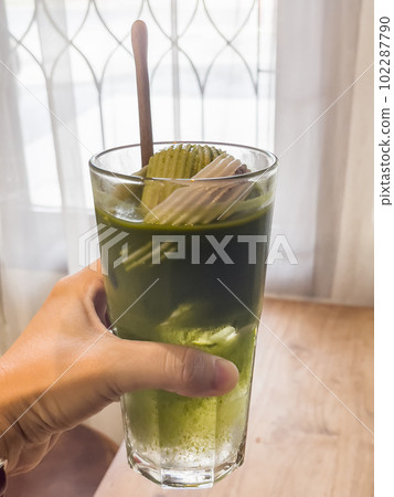 Green tea with coconut juice in coffee shop cafe Green tea with coconut juice in coffee shop cafe 102287790