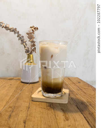 Iced coffee with milk in coffee shop Iced coffee with milk in coffee shop 102287797