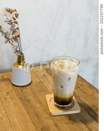 Iced coffee with milk in coffee shop Iced coffee with milk in coffee shop 102287798