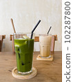 Green tea with coconut juice in coffee shop cafe 102287800