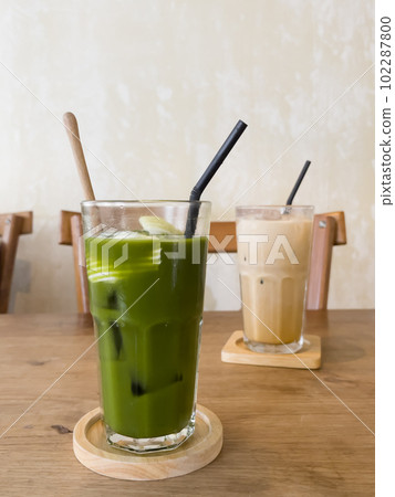 Green tea with coconut juice in coffee shop cafe Green tea with coconut juice in coffee shop cafe 102287800