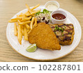 Fish and chips with grilled chicken spicy steak 102287801