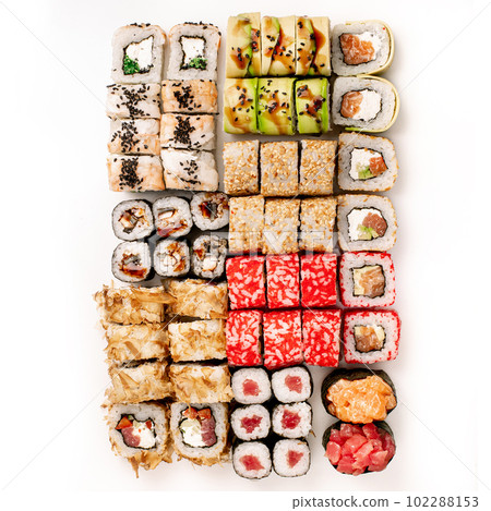 Big colorful sushi set on a white background. Top view. Big colorful sushi set on a white background. Top view. 102288153