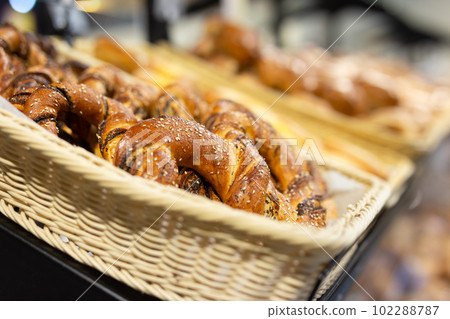 delicious bavarian pretzel in baskets in bakery delicious bavarian pretzel in baskets in bakery 102288787