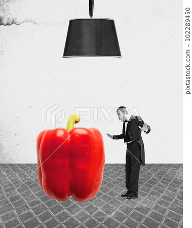 Contemporary art collage with man wearing tailcoat shocked by the size of the red pepper over black and white background Contemporary art collage with man wearing tailcoat shocked by the size of the red pepper over black and white background 102289450