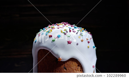 Easter cake decoration colorful decorative sprinkles on dark studio background 102289960