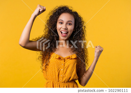 Pretty woman shows triumph yes gesture of victory, she achieved result, goals. 102290111