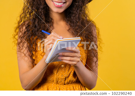 Hands of woman writing notes in planner.Student girl thinking about future plans Hands of woman writing notes in planner.Student girl thinking about future plans 102290240