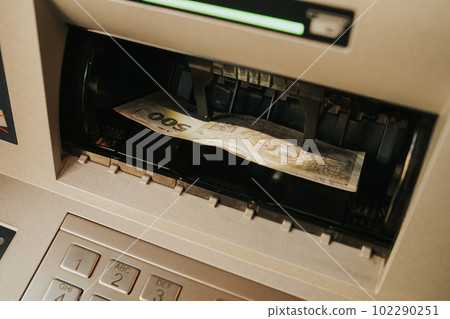 Withdrawal of Czech crowns in cash from ATM, money transactions Withdrawal of Czech crowns in cash from ATM, money transactions 102290251