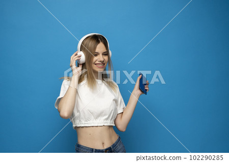 Portrait of her she attractive lovely charming cheery girl listening podcast motivation playlist or relax music. Portrait of her she attractive lovely charming cheery girl listening podcast motivation playlist or relax music. 102290285