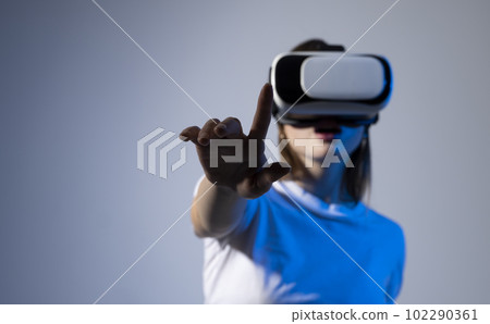 Female engineer wearing virtual reality headset designing a new pruducts or technologis using VR technology. Development and prototyping software. 102290361