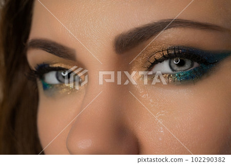 Ukrainian woman close-up, eyes crying, tears running down face.Pain,war, Ukraine Ukrainian woman close-up, eyes crying, tears running down face.Pain,war, Ukraine 102290382