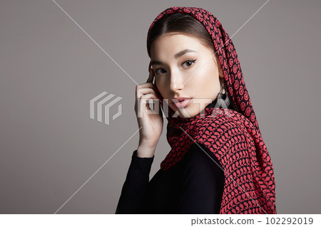 beautiful young woman in color veil and jewelry. beauty girl in colorful hijab beautiful young woman in color veil and jewelry. beauty girl in colorful hijab 102292019