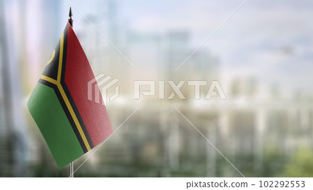 Small flags of the Vanuatu on an abstract blurry background 102292553