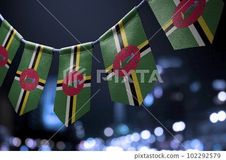 A garland of Dominica national flags on an abstract blurred background A garland of Dominica national flags on an abstract blurred background 102292579