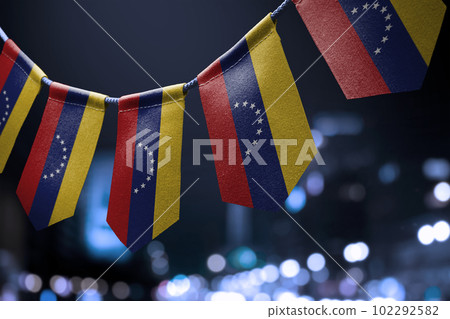 A garland of Venezuela national flags on an abstract blurred background A garland of Venezuela national flags on an abstract blurred background 102292582