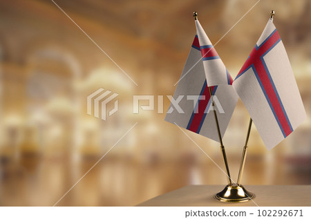 Small flags of the Faroe Islands on an abstract blurry background Small flags of the Faroe Islands on an abstract blurry background 102292671